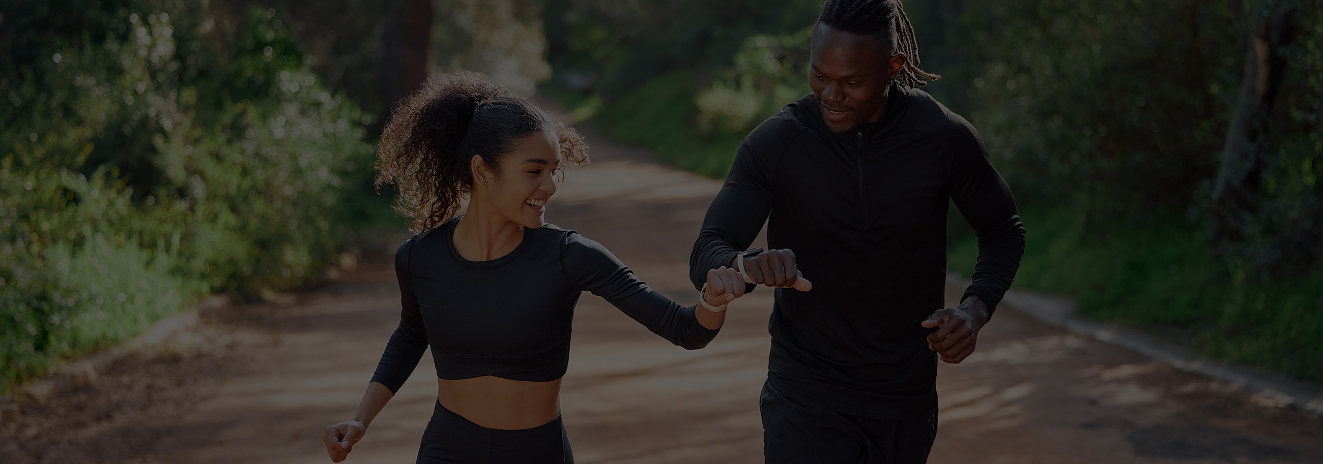 Two friends enjoying a run outdoors.