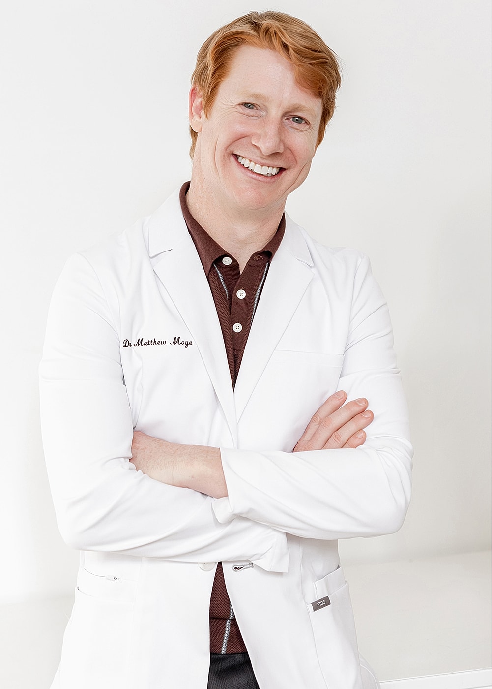 Smiling doctor in a white lab coat.