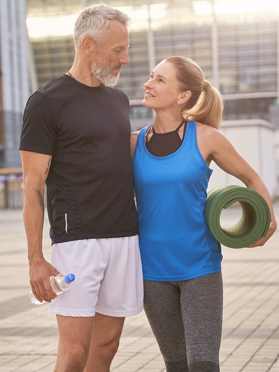 Couple enjoying fitness together outdoors.