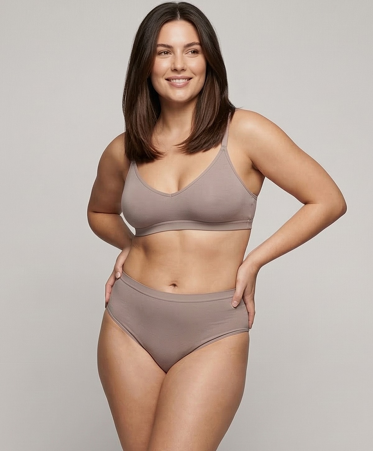 Model wearing comfortable, neutral-toned lingerie set.