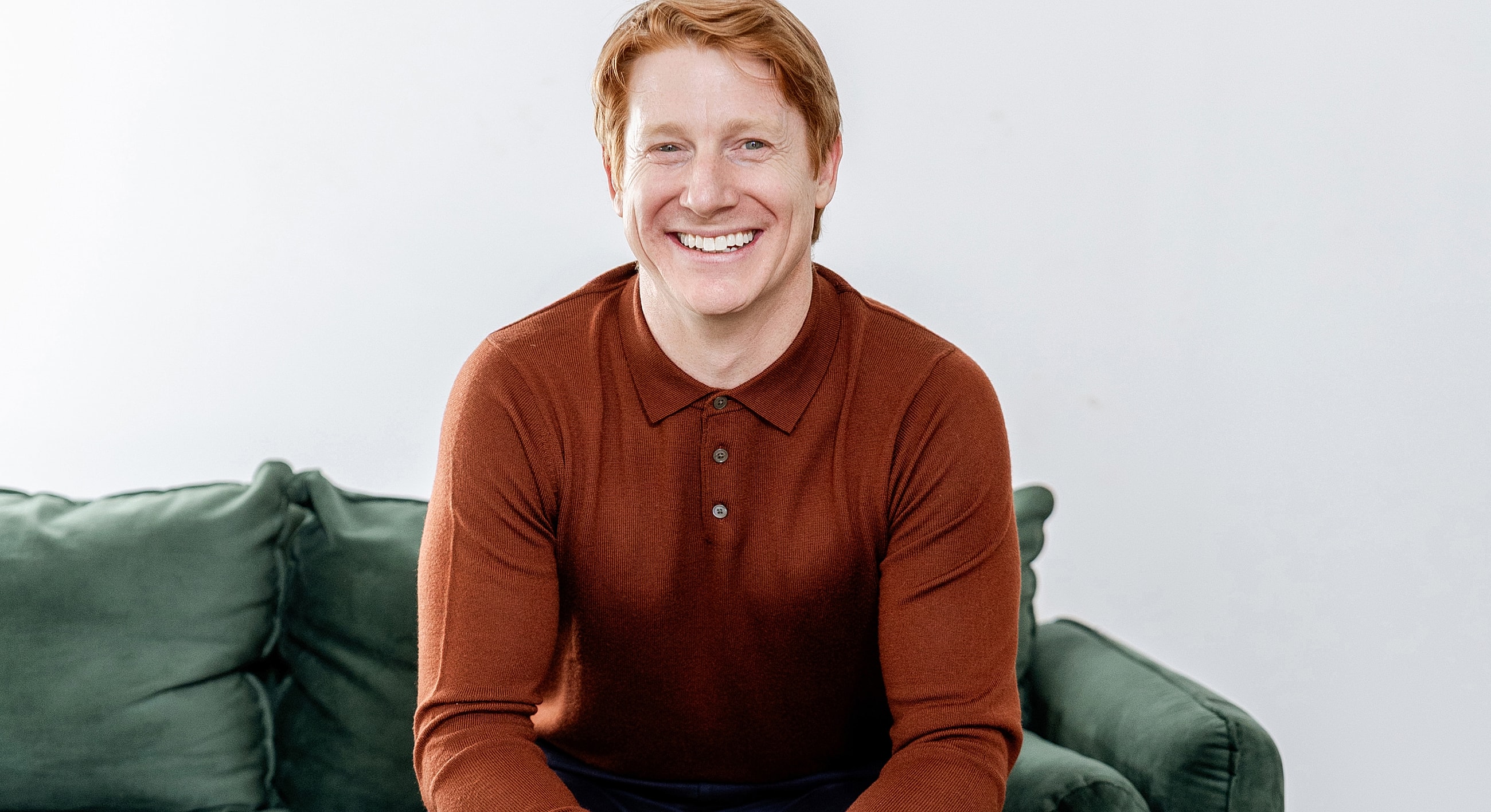 Person looking out a window in a relaxed pose.